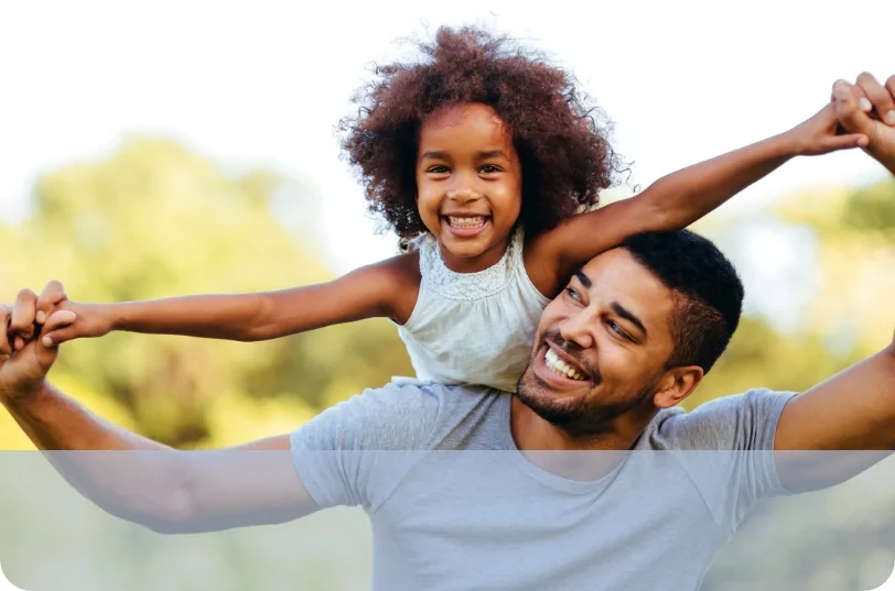 Man smiling with daughter