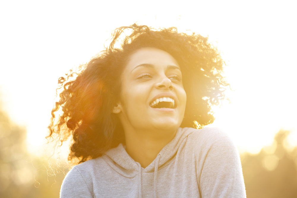 Women smiling by sunset