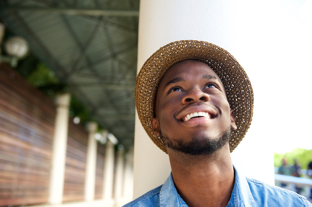 Man in hat smiling