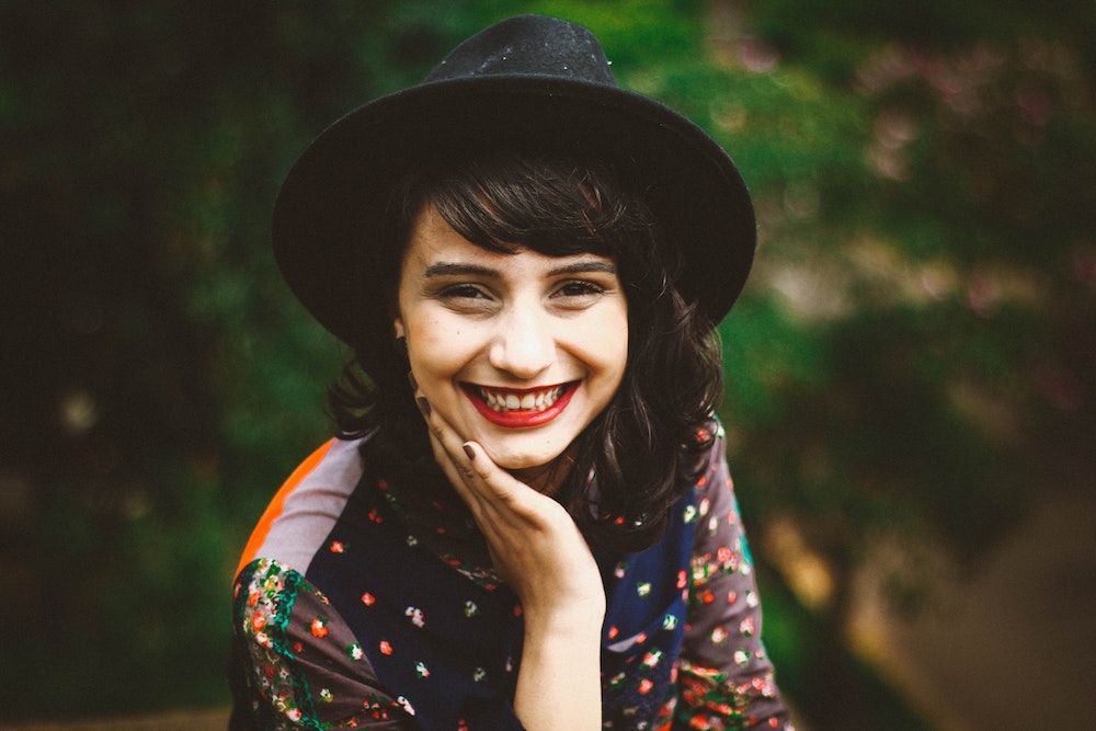 Woman with hat outside