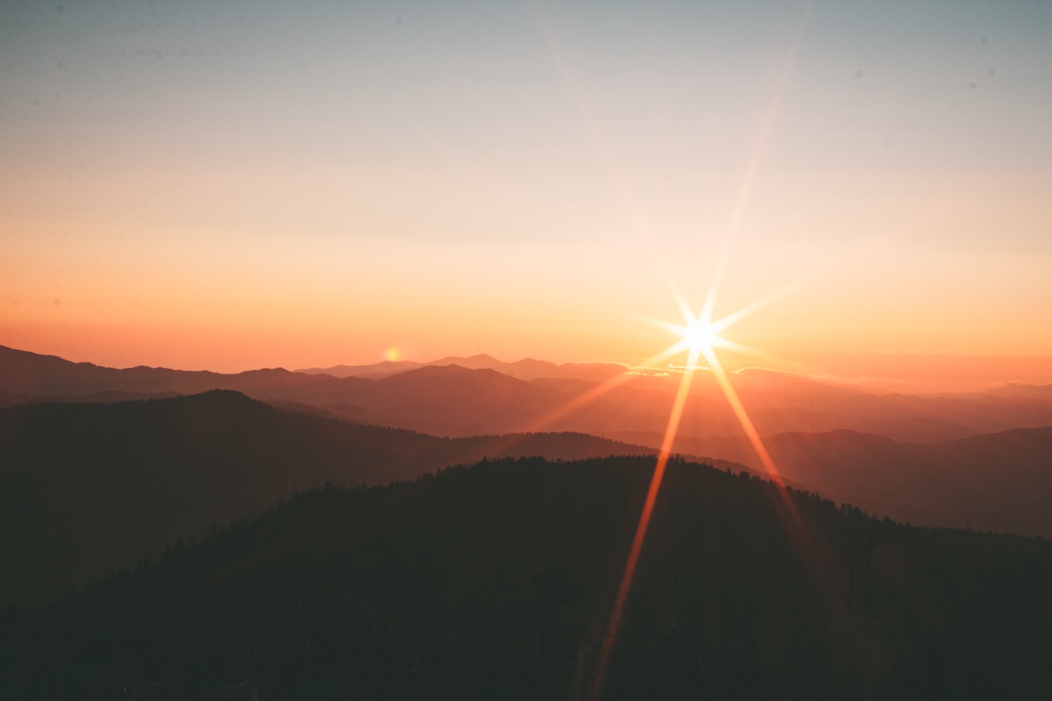 Sunset over dark mountains