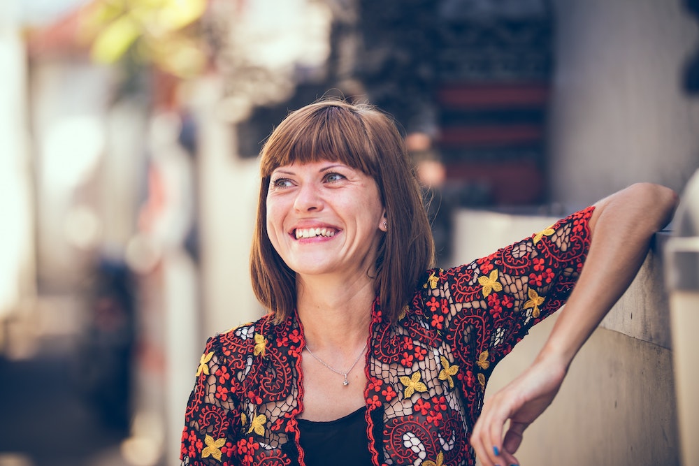 Woman with bangs outside