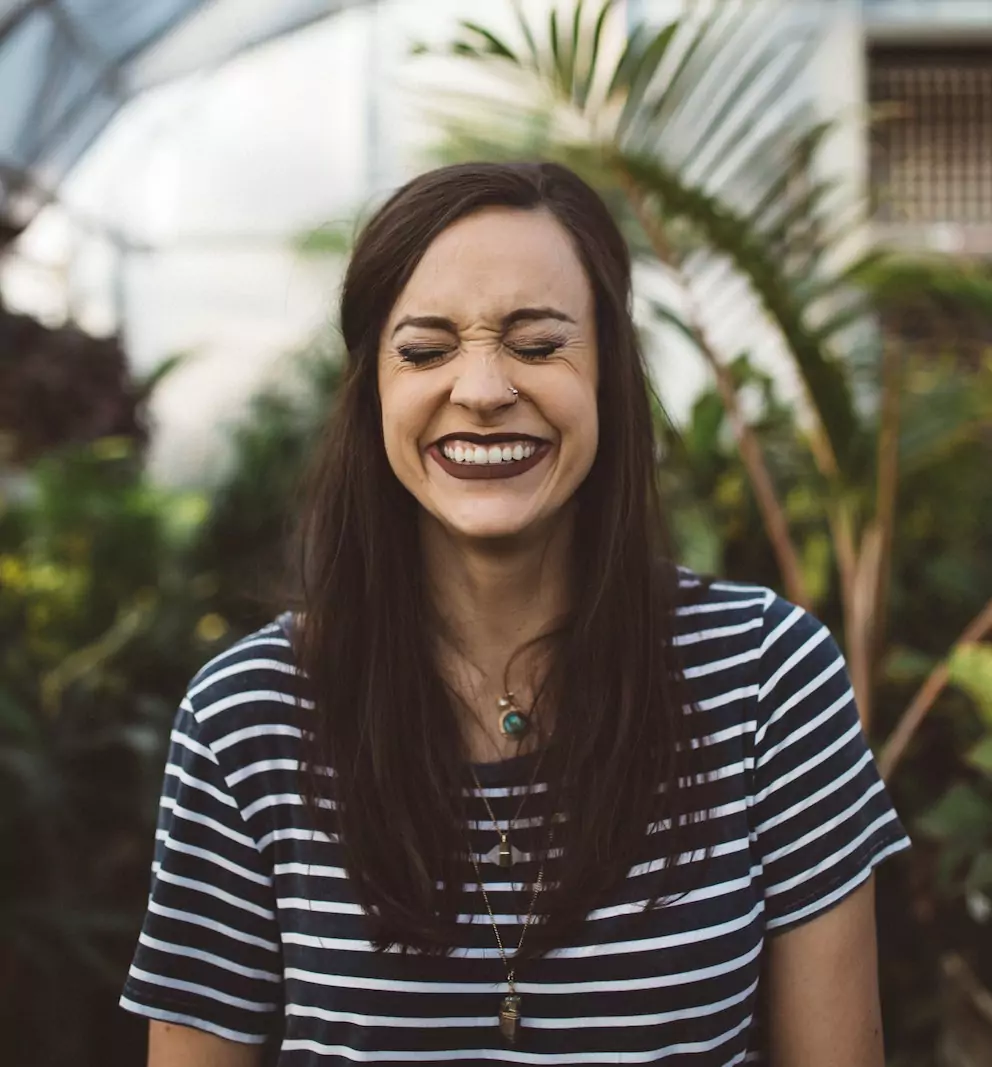 Woman smiling with eyes closed